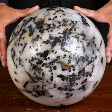 Quartz sphere with black tourmaline