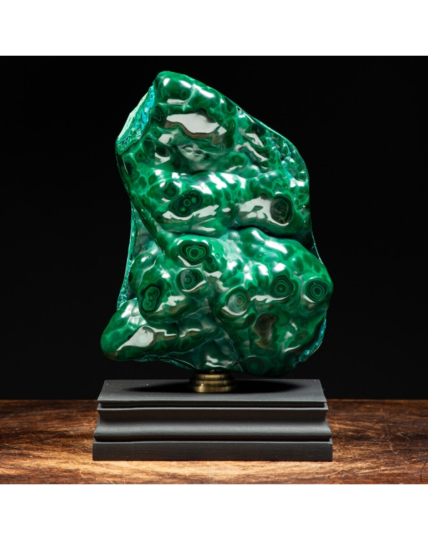 Malachite on wood pedestal with brass element