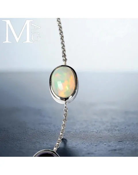 Collier con opale, ametista, smeraldo e diamante – ali in madreperla