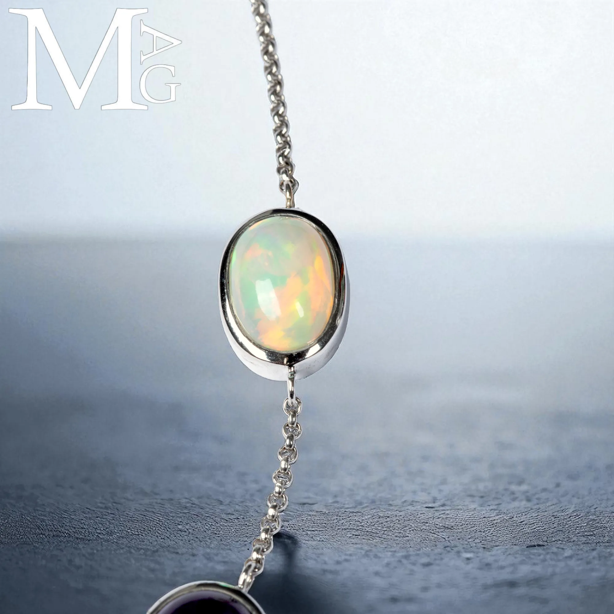 Collier con opale, ametista, smeraldo e diamante – ali in madreperla