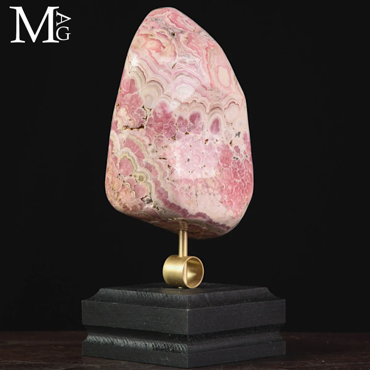 Rodocrosite –  campione levigato su base in ottone e legno.