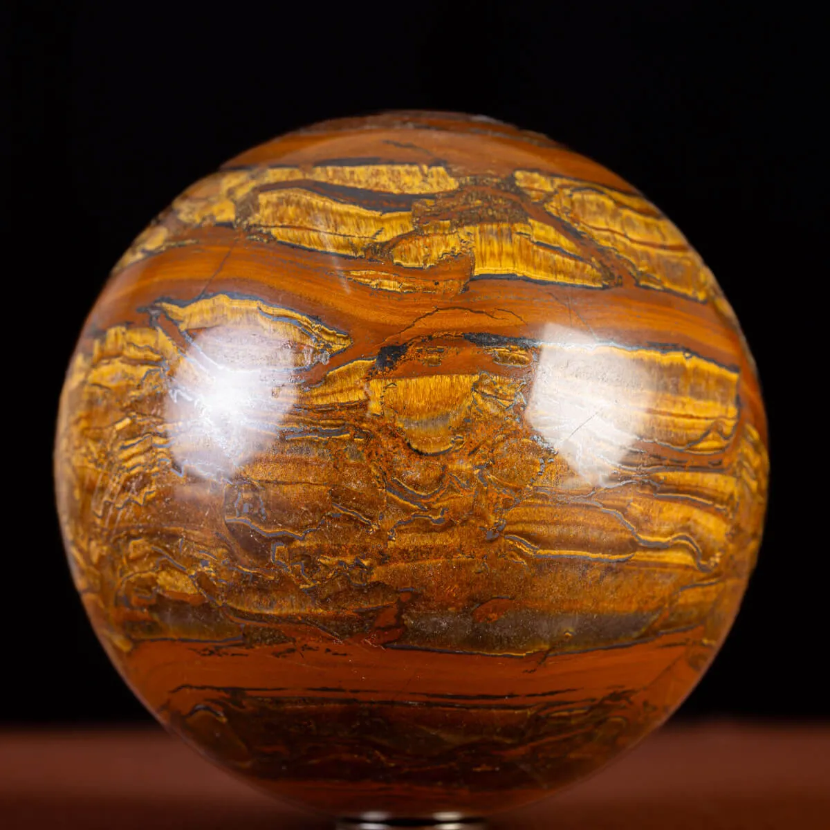 Sfera in Tiger Iron Intagliata.